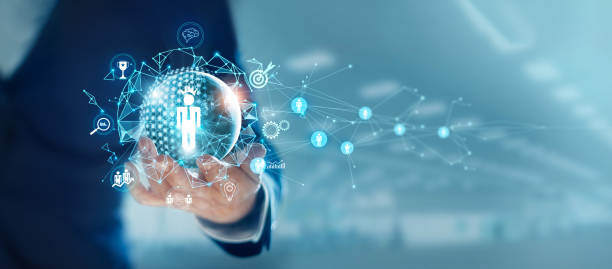 Hand holds a sphere representing a technological network